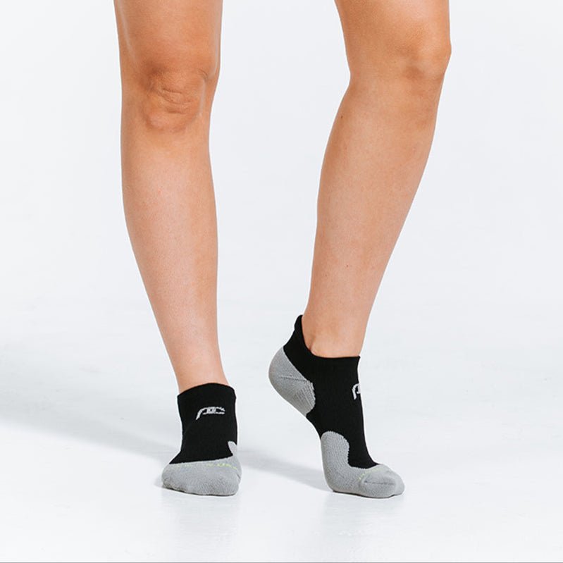 PRO Compression Trainer Low Tab socks in black | Ankle Compression Socks | woman wearing socks close up