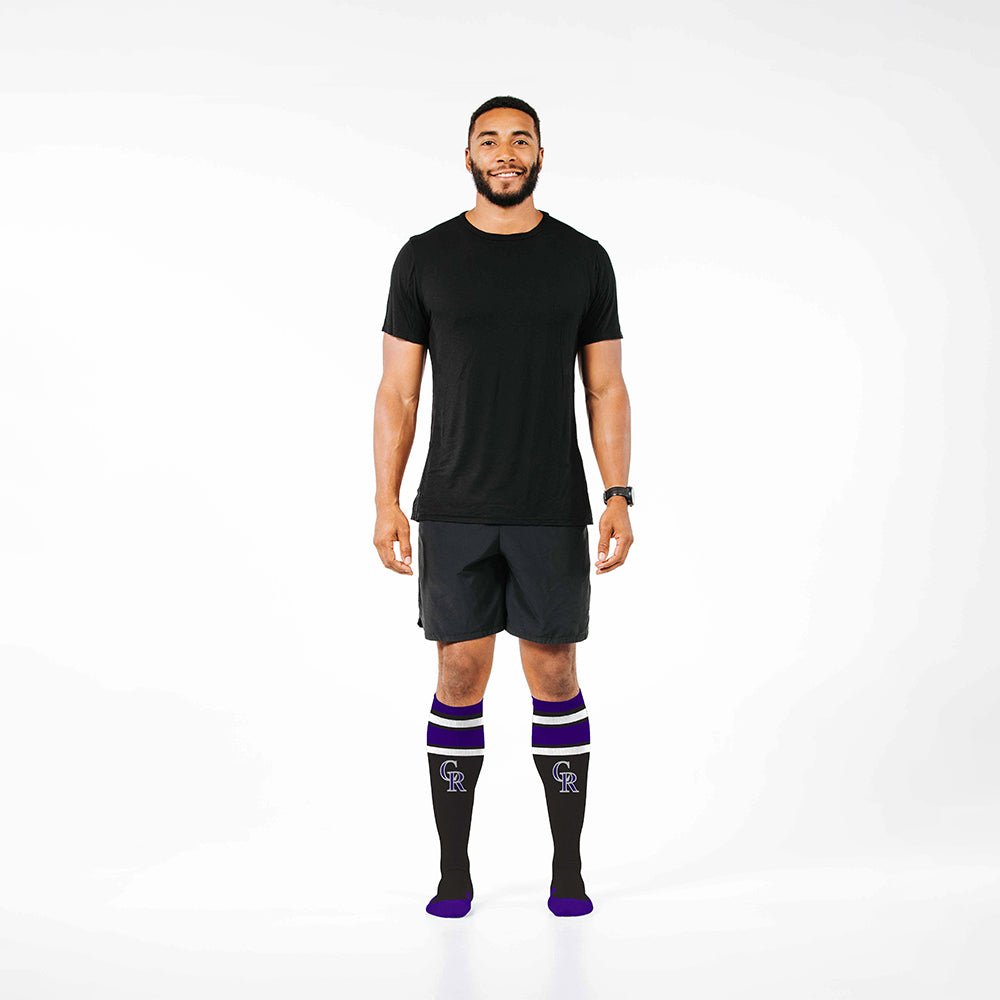 Man wearing PRO Compression Major League Baseball Knee High Compression Sock Genuine MLB Merchandise Sock Colorado Rockies
