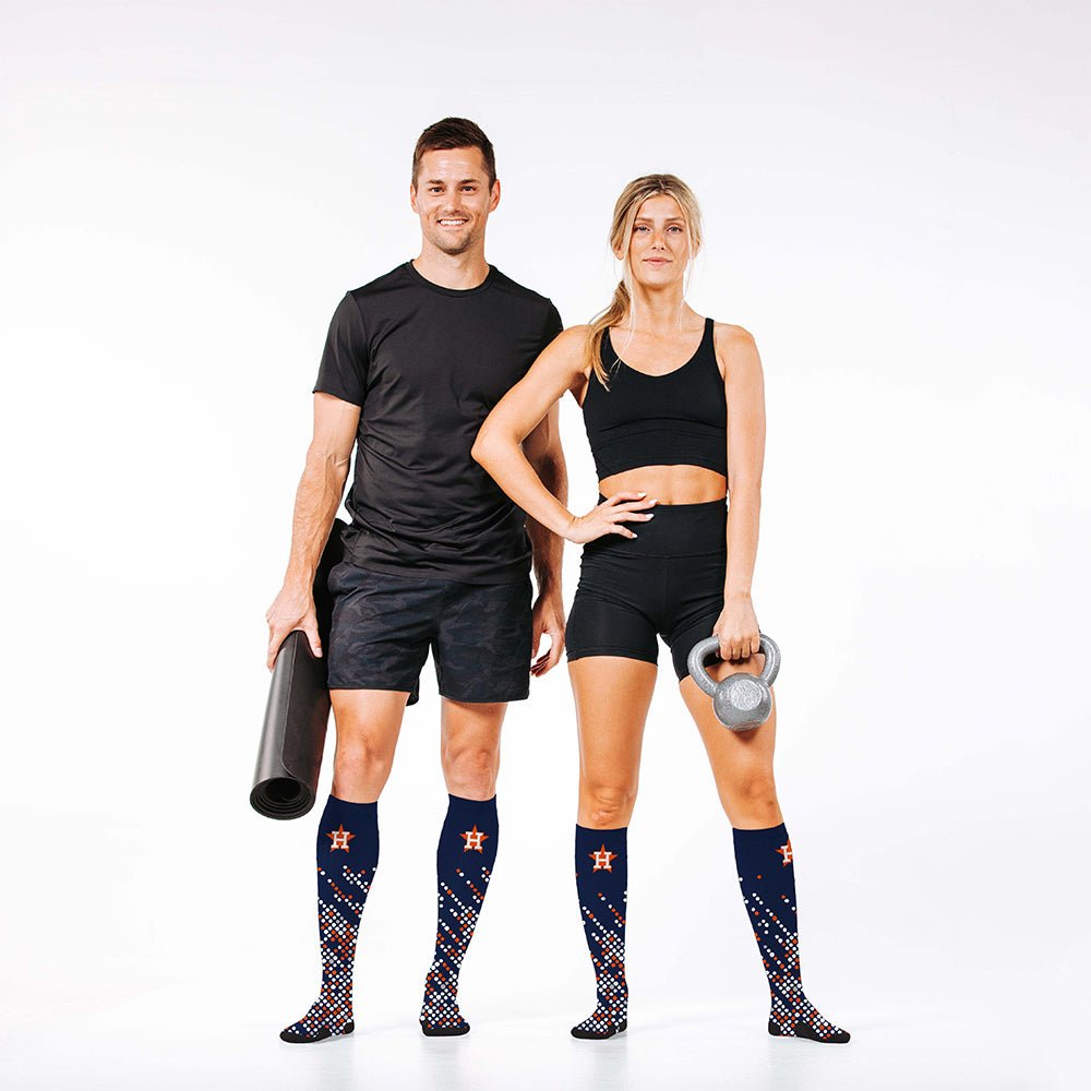 Man and woman wearing PRO Compression Major League Baseball Knee High Compression Sock Genuine MLB Merchandise Sock Houston Astros