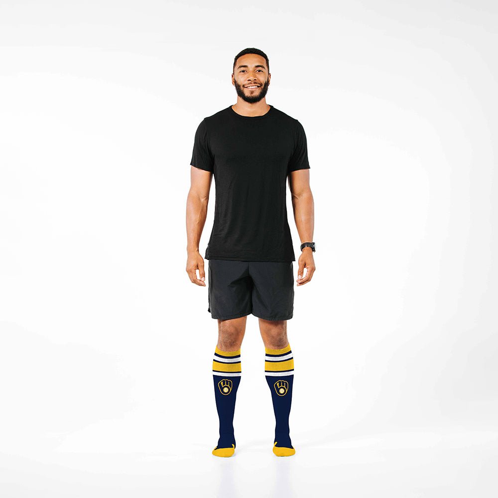 Man wearing PRO Compression Major League Baseball Knee High Compression Sock Genuine MLB Merchandise Sock Milwaukee Brewers