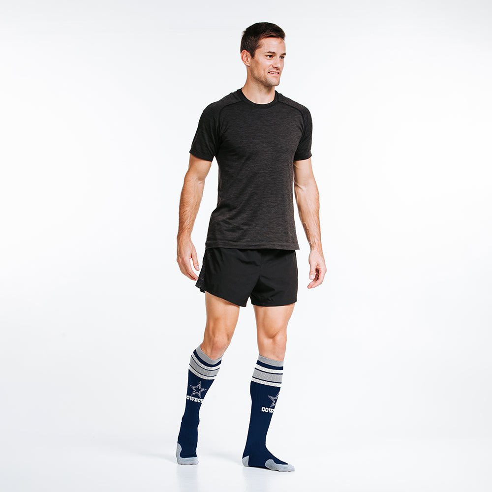 Male model wearing Dallas Cowboys officially-licensed NFL Knee-high Compression Socks