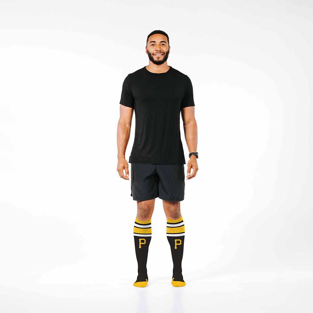 Man wearing PRO Compression Major League Baseball Knee High Compression Sock Genuine MLB Merchandise Sock Pittsburgh Pirates