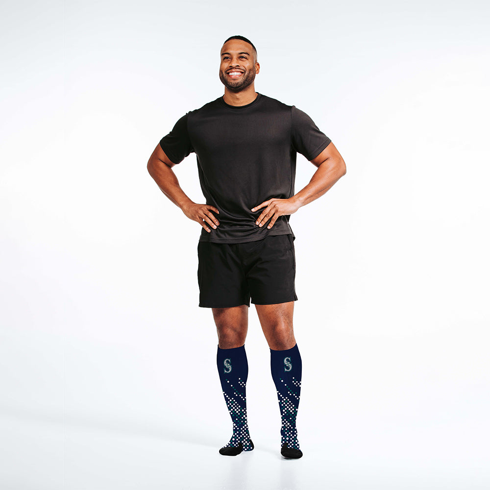 Man wearing PRO Compression Major League Baseball Knee High Compression Sock Genuine MLB Merchandise Sock Seattle Mariners