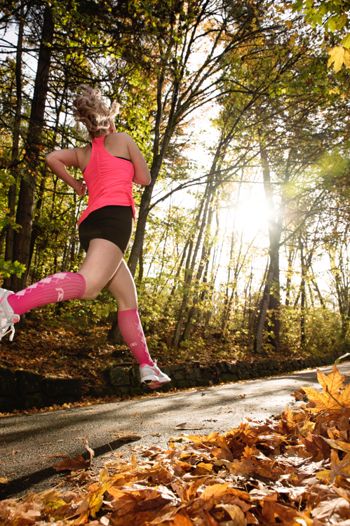 Woman Trail Runner in Pink Compression Socks