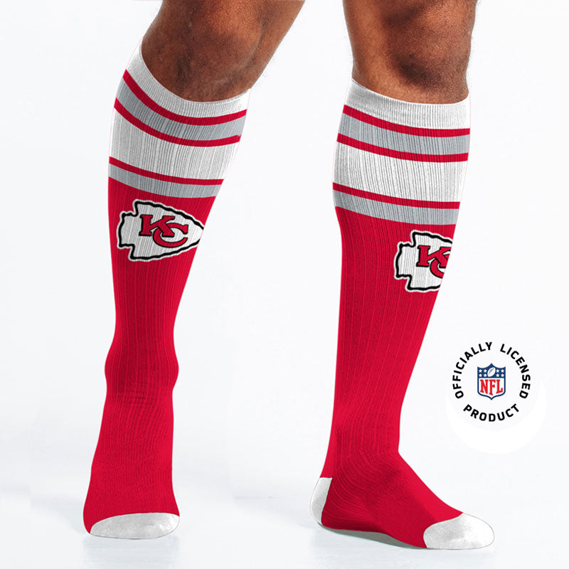 Officially licensed Kansas City Chiefs Knee-high Compression Socks on male model.
