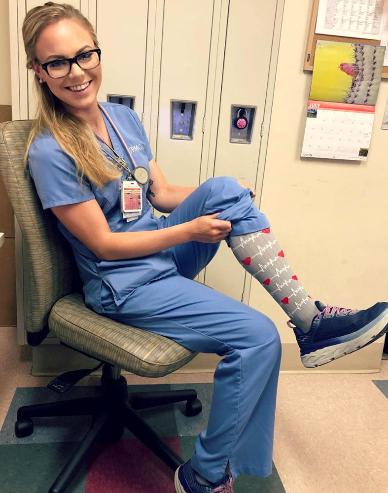 Female nurse wearing PRO Compression Knee High Nurse Compression Socks.