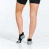 PRO Compression Trainer Low Tab socks in black | Ankle Compression Socks | Close up of woman wearing socks