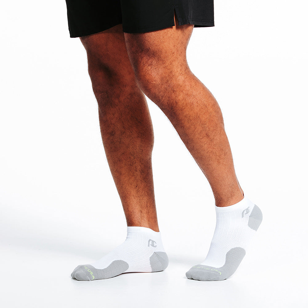 Low white compression socks with grey toe and heel boxes - male model