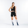 knee high compression socks with navy blue daisies design on model