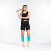 Orange BOOM design in PRO Compression knee high compression socks. Bright orange and teal design with lavender cuff, toe and heel boxes on female model.