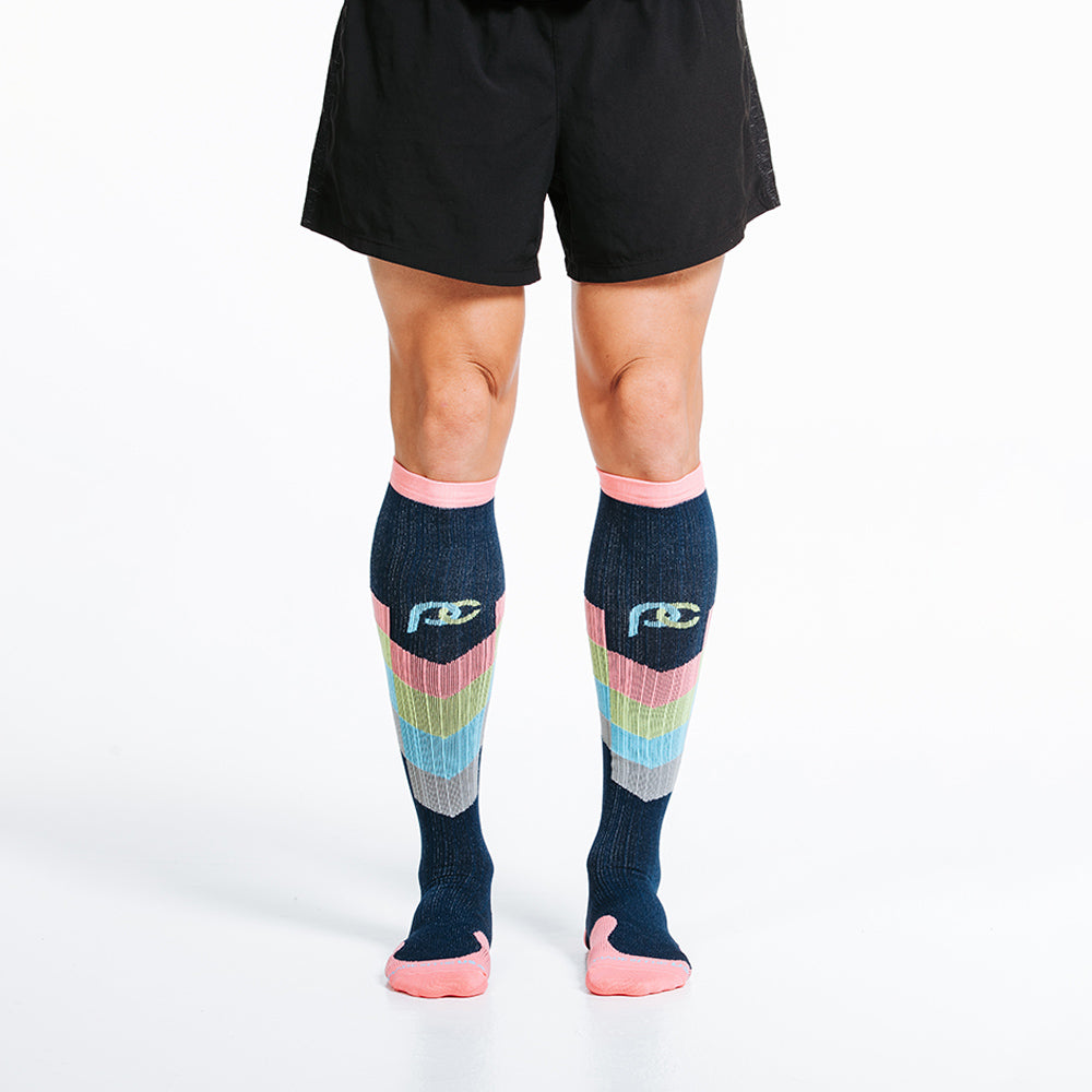 Marathon knee high compression socks in pastel chevron design motif - model close up