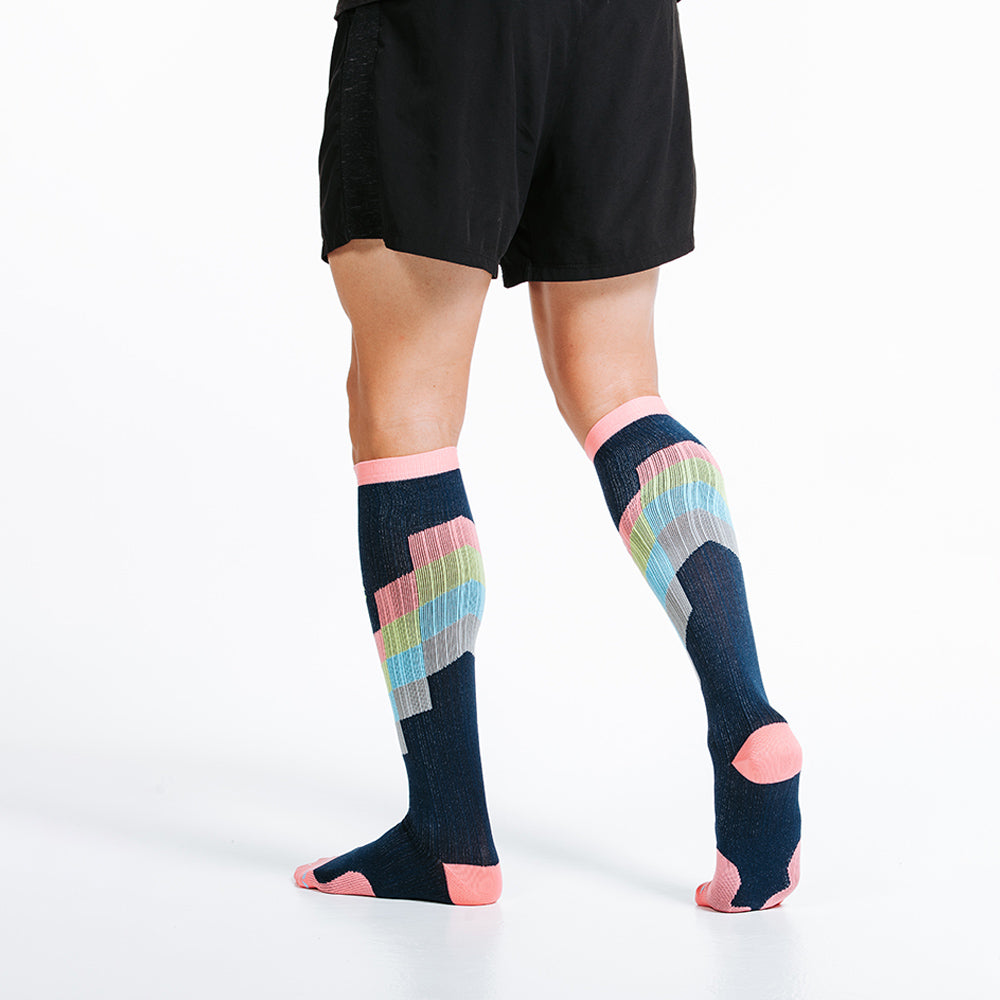 Marathon knee high compression socks in pastel chevron design motif - model walking