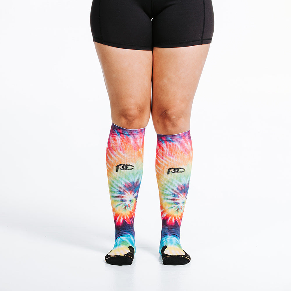 Knee high rainbow tie dye compression socks - close up on feet