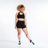 Knee high rainbow tie dye compression socks on model