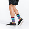 Striped colorful crew socks woven with lightweight compression for relaxed days - on model walking 