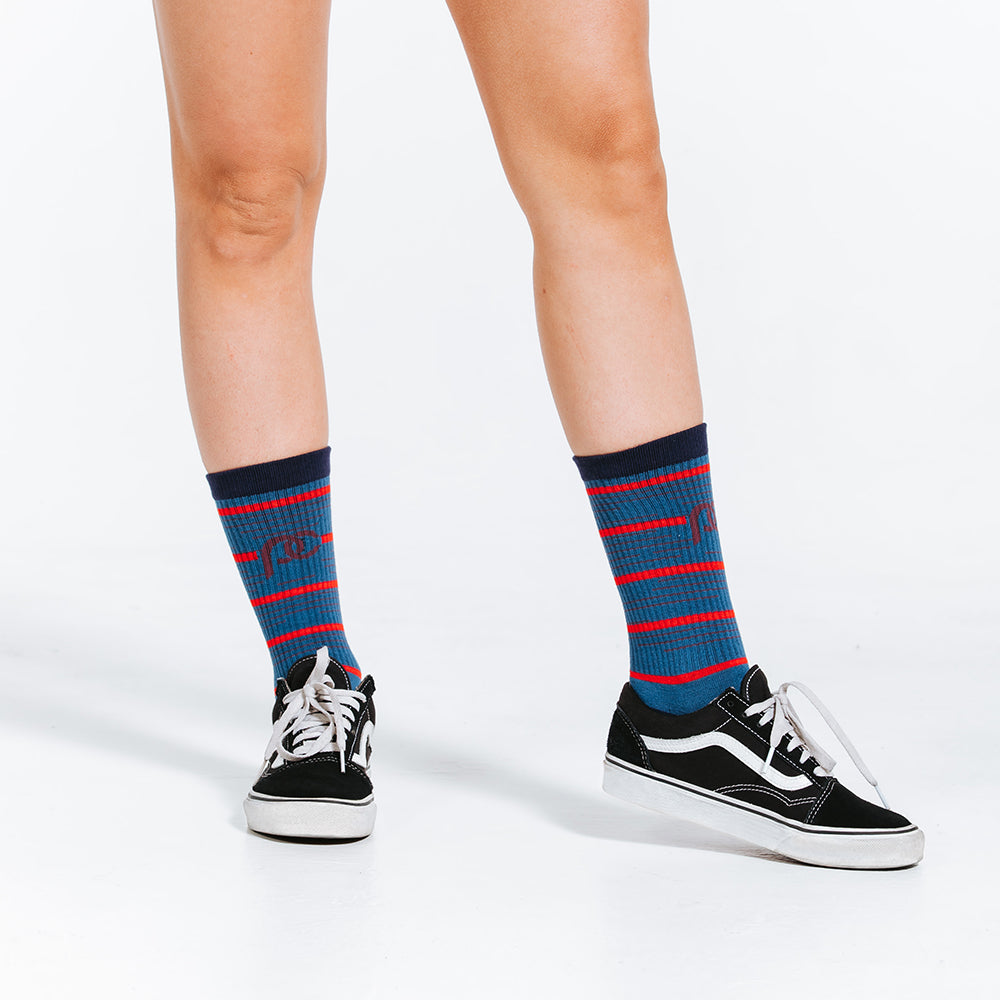 Crew length compression socks in red and blue - close up on socks