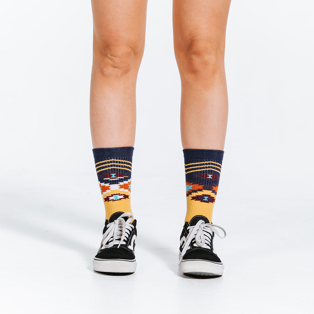 Mid calf compression socks with Chevron Aztec gold design - close up of feet