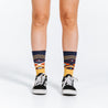 Mid calf compression socks with Chevron Aztec gold design - close up of feet