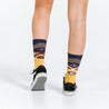 Mid calf compression socks with Chevron Aztec gold design - close up on model rear view