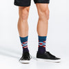 Crew length compression socks with Chevron Aztec blue design - close up on model standing