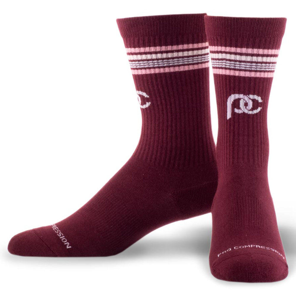 Maroon crew length compression socks with thin pink and white stripes near top - pair