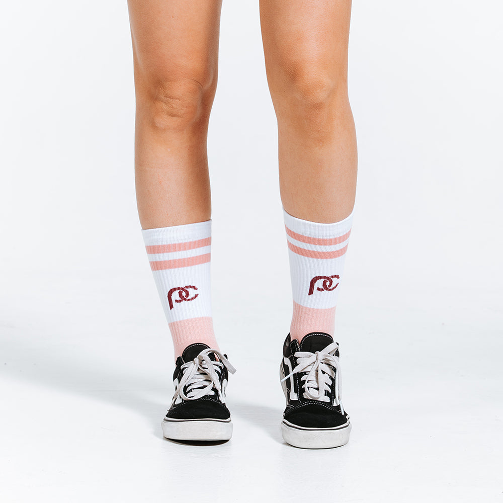 Peach and white crew length compression socks - close up on feet