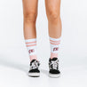 Peach and white crew length compression socks - close up on feet