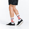 White crew length compression socks with black and red New York City design - close up posterior view