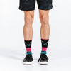 Colorful crew length compression socks with stars - close up of socks on feet