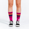 Pink, gold, and navy blue crew length compression socks - close up on feet