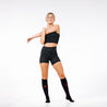 PRO Compression Marathon socks for running and recovery close up of female wearing black knee-high sock