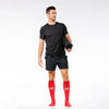 Knee-high Recovery Compression Sock 25-35 mmHg | Male holding yoga mat and wearing red knee high compression socks