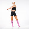Knee-high Recovery Compression Sock 25-35 mmHg | female wearing rose pink knee high compression socks
