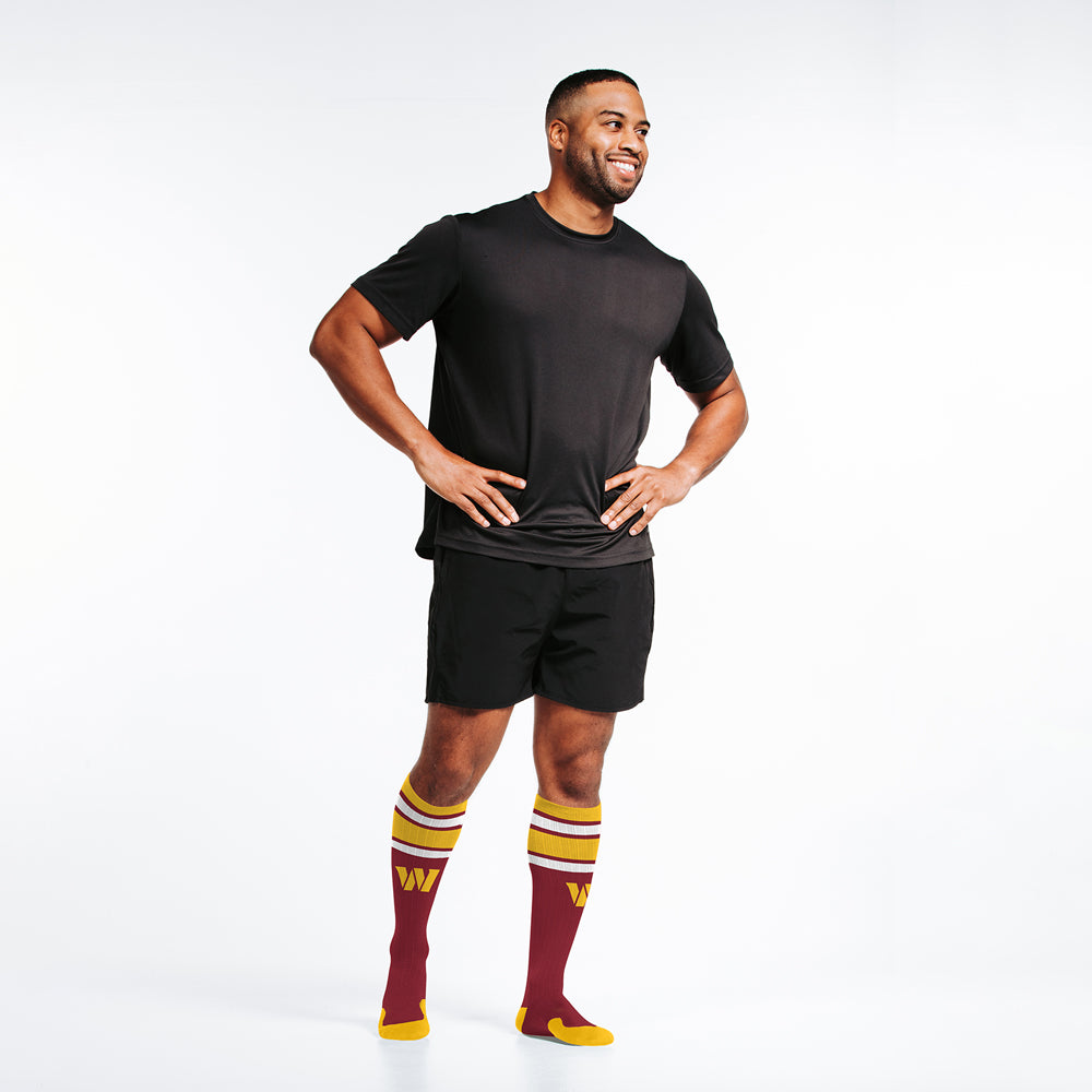 Male model wearing Washington Commanders officially-licensed NFL Knee-high Compression Socks