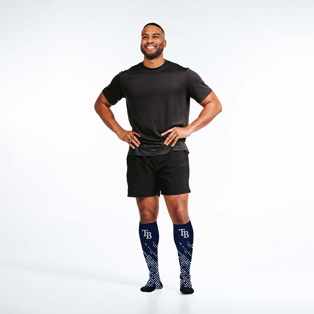 Man wearing PRO Compression Major League Baseball Knee High Compression Sock Genuine MLB Merchandise Sock Tampa Bay Rays