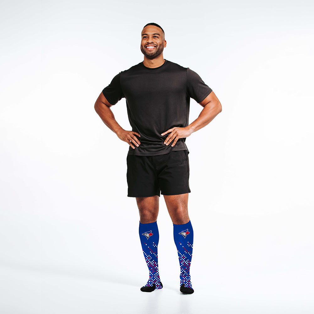 Man wearing PRO Compression Major League Baseball Knee High Compression Sock Genuine MLB Merchandise Sock Toronto Blue Jays