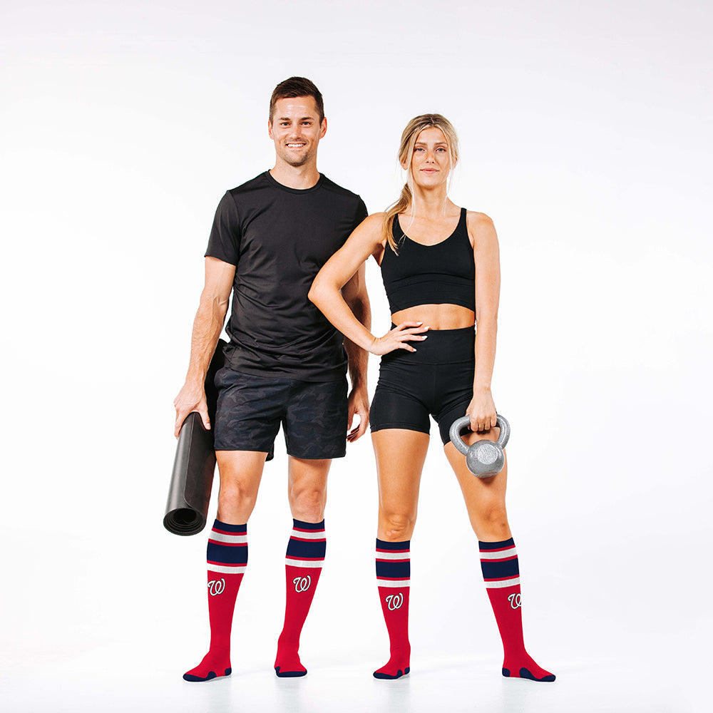 Man and woman wearing PRO Compression Major League Baseball Knee High Compression Sock Genuine MLB Merchandise Sock Washington Nationals